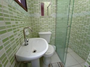 a bathroom with a sink and a toilet at Hotel Pousada Viana in São Paulo