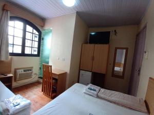 Hotel Pousada Viana tesisinde bir odada yatak veya yataklar