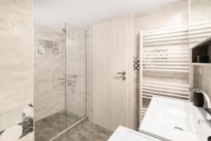 a bathroom with a shower and a sink at Katsanis luxury apt., stunning view of acropolis in Athens +33 photos