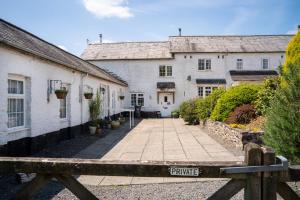 a view of the courtyard of a house at Enchanted Retreats at West Ford Devon in South Molton