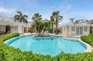 una piscina frente a una casa en Exclusive Punta Cana Resort and Club Pool Villas, en Punta Cana