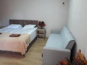 En eller flere senger på et rom på Guest House Mari30
