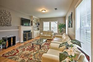 a living room with a couch and a fireplace at Modern Houston Home Less Than 4 Miles to Houston Zoo! in Houston
