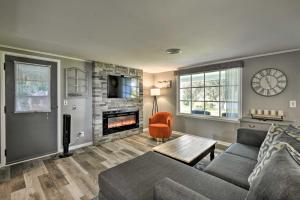 a living room with a couch and a fireplace at Quiet New York Retreat Less Than 7 Miles to Skiing! in Homer
