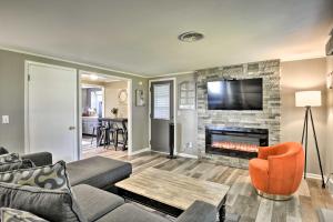 a living room with a couch and a fireplace at Quiet New York Retreat Less Than 7 Miles to Skiing! in Homer