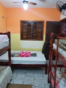 Postel nebo postele na pokoji v ubytování Casa de praia com piscina Bertioga