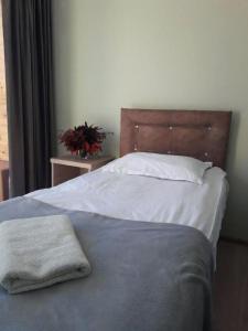 En eller flere senger på et rom på Guest House Mari30