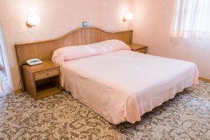 A bed or beds in a room at Hotel Terrazzo d'Abruzzo