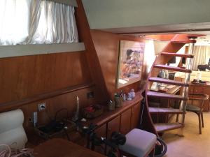 a room with a staircase and a room with a desk at The boathouse in Benalmádena