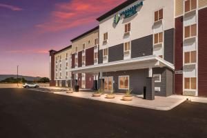 a rendering of a hotel with a parking lot at WoodSpring Suites Tucson-South in Tucson