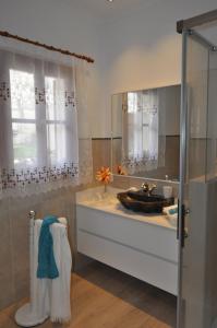 a bathroom with a sink and a mirror at Casa Amanada in Santa Margalida +18 photos