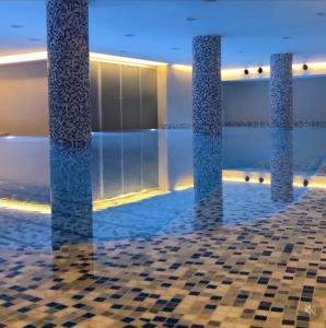 a rendering of a pool of water with three pillars at Lux Pegaz 008 in Vrnjačka Banja