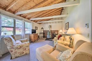 a living room with two couches and a tv at Rustic Retreat Across from Lake Family Friendly! in Union