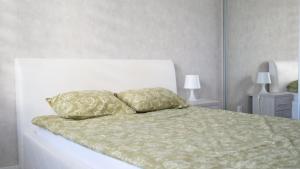 Кровать или кровати в номере Apartamenty Piotrkowska