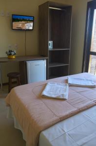 Postel nebo postele na pokoji v ubytování Hotel Pousada Capão