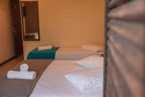 Postel nebo postele na pokoji v ubytování Hotel Pousada Capão