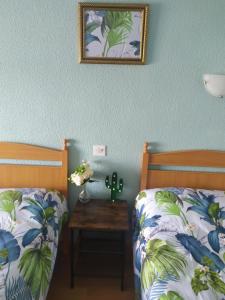 Säng eller sängar i ett rum på Hostal Ruta Del Sur