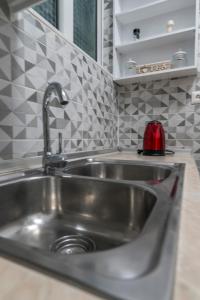 Kuchyň nebo kuchyňský kout v ubytování Armonia Porta Remounda Apartment + 19 fotografií