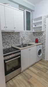Kuchnia lub aneks kuchenny w obiekcie Armonia Porta Remounda Apartment