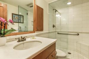 a bathroom with a sink and a toilet and a mirror at Deluxe Two Bedroom - Aspen Alps #504 in Aspen