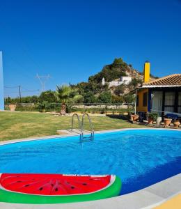 a swimming pool with a slice of watermelon at Casa Spannika Pool And Gym in Zakynthos Town