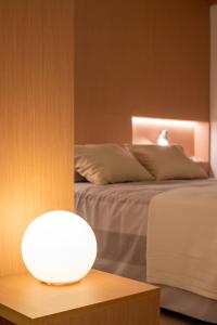 A bed or beds in a room at LOFT DESIGN GRANADA CENTER 2min CATHEDRAL FREE WIFI