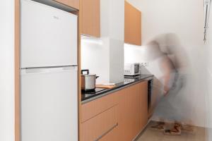 A kitchen or kitchenette at LOFT DESIGN GRANADA CENTER 2min CATHEDRAL FREE WIFI