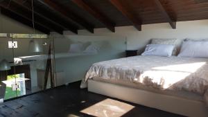 Postel nebo postele na pokoji v ubytování Lithos Villas