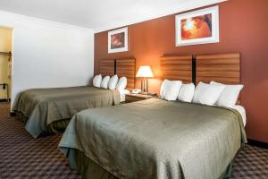 Ένα ή περισσότερα κρεβάτια σε δωμάτιο στο Quality Inn Rutland