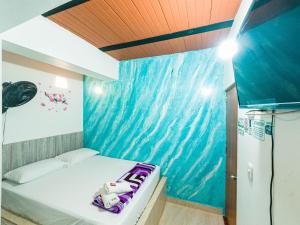 Postel nebo postele na pokoji v ubytování Hotel Jireh - San Carlos Ant