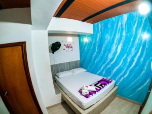 Postel nebo postele na pokoji v ubytování Hotel Jireh - San Carlos Ant