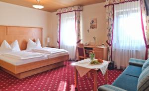 Posteľ alebo postele v izbe v ubytovaní Hotel Mader