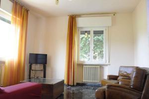 a living room with a couch and a window at Apartment in Lazise - Gardasee 41952 in Lazise