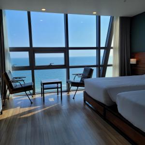 Postel nebo postele na pokoji v ubytování MS Hotel Haeundae