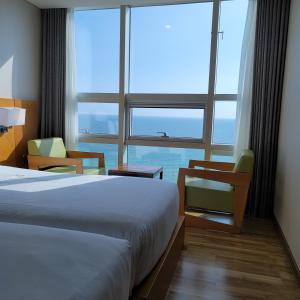Postel nebo postele na pokoji v ubytování MS Hotel Haeundae
