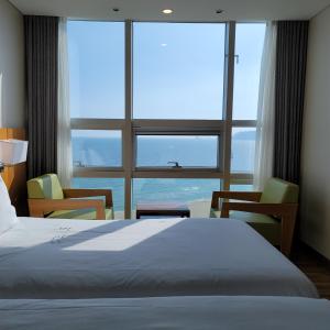 Postel nebo postele na pokoji v ubytování MS Hotel Haeundae