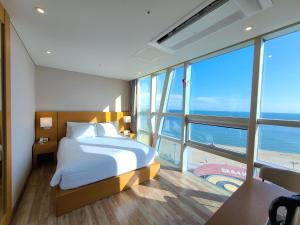 Postel nebo postele na pokoji v ubytování MS Hotel Haeundae