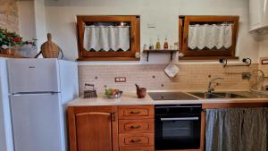 Kuchyňa alebo kuchynka v ubytovaní La casa della maestra località San Giovanni Spello