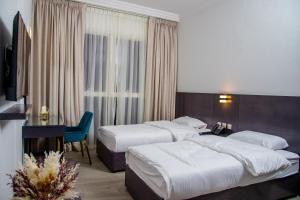 Garden City Hotel Dubai 객실 침대