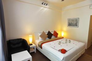Postel nebo postele na pokoji v ubytování TME Retreats Dhigurah