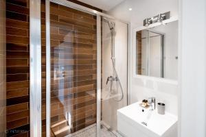 a bathroom with a shower and a sink at Harenda Residence in Zakopane