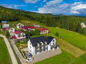 an aerial view of a large house in the mountains at Comfort House in Bukovel