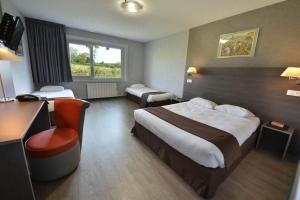 a hotel room with a bed and a desk at Hotel du Val Vert in Pouilly-en-Auxois