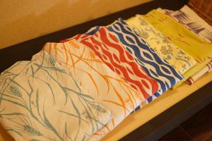 a group of ties sitting on top of a table at Soumeian in Kusatsu