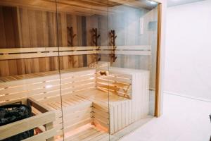 a walk in shower with a glass wall at Penzión Flámm in Rajecké Teplice