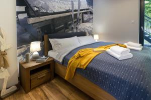 Posteľ alebo postele v izbe v ubytovaní SPA Apartament Jenny Ski&Fun widok na Skrzyczne i skocznię "Skalite"