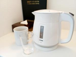 a white mixer and two glasses on a counter at Akasaka Urban Hotel in Tokyo