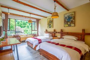 Galería fotográfica de Jiaju Legend Homestay en Danba