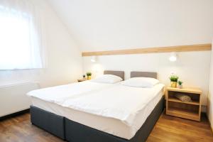 Postel nebo postele na pokoji v ubytování Apartments Čatež - Terme Čatež