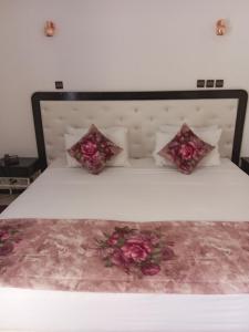Postel nebo postele na pokoji v ubytování Hotel Al Kabir